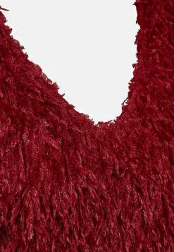 Juhlatoppi höyhenenkaltaisella materiaalilla