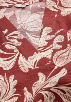 Kuviollinen mekko taskuilla