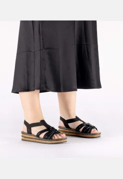 Sandaali joustoremmeillä ja letitetyllä koristeella